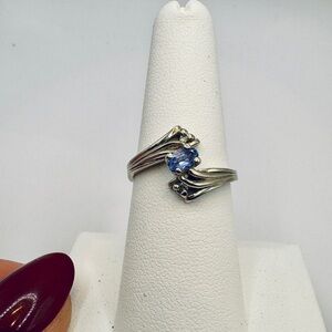 Elegant silver and lilac purple tanzanite ring with diamond accents size 7